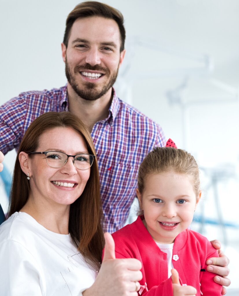 Satisfied family with a smiling young female dentist
